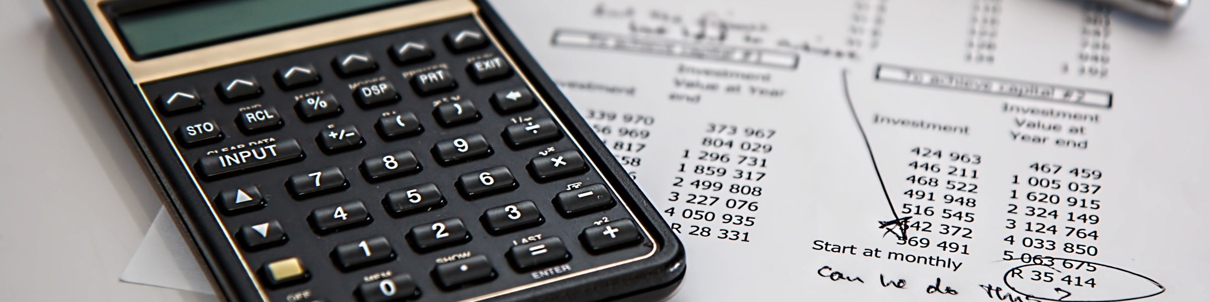 Black Calculator Near Ballpoint Pen On White Printed Paper 53621